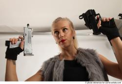 NIKOL STANDING POSE WITH TWO GUNS